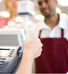 A hand swiping a card