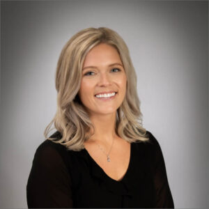 Dr. Taylor Johnson, with a vibrant smile