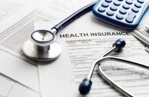 an image of health insurance forms on a desk