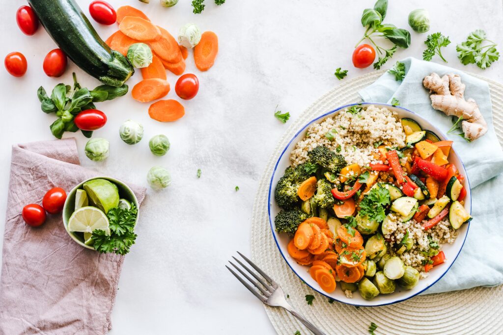 a table full of healthy food like fruits and vegetables, part of healthy habits for the new year