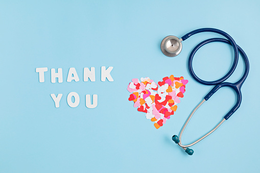 Hearts confetti and text thank you. Expressing gratitude to doctors and nurses idea