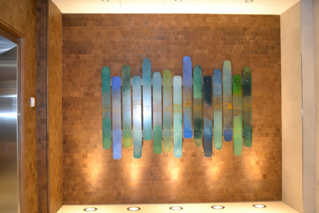 a piece of abstract artwork on the wall of a hotel