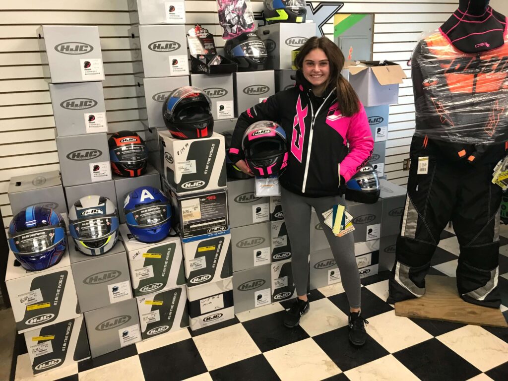 A young woman wearing fashionable and function winter gear.