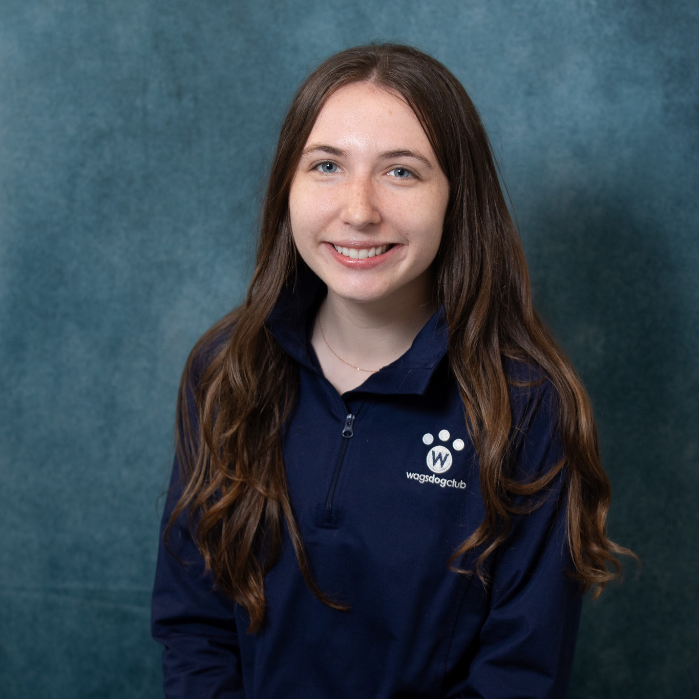 Kayla smiling with dog